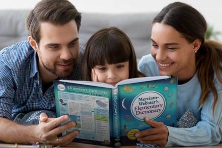 parents and child reading elementary dictionary